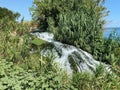 A small waterfall and mossy rocks in a wood Royalty Free Stock Photo