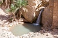 Small waterfall in mountain oasis the Chebika at border of Sahara, Tunisia, Africa Royalty Free Stock Photo