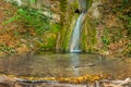 Waterfall on mountain river falling into pool Royalty Free Stock Photo