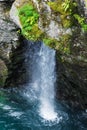 small waterfall in the mountains of Norway in summer Royalty Free Stock Photo