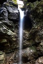 Small waterfall in narrow gorge Royalty Free Stock Photo