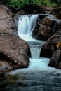 A small waterfall in nature. Royalty Free Stock Photo