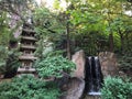 Small waterfall next to Japanese temple