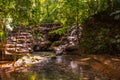 Small waterfall out of season. Mountain stream in green forest at spring time. Palenque, Chiapas, Mexico. Royalty Free Stock Photo