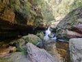 Small waterfall over rocks on Greaves Creek on the Grand Canyon Walking Track Royalty Free Stock Photo