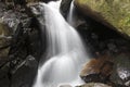 A small waterfall in the rock Royalty Free Stock Photo