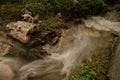 Small waterfall with running water, silk effect, natural waterfall landscape