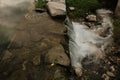 Small waterfall with running water, silk effect, natural waterfall landscape Royalty Free Stock Photo