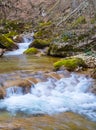 small waterfall on rushing mountain river Royalty Free Stock Photo