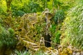 The small waterfall and stone bridge, Quinta da Regaleira garden, Sintra, Portugal Royalty Free Stock Photo