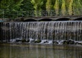 Small waterfall under the bridge Royalty Free Stock Photo