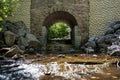 Small Waterfall Under a Stone Bridge Royalty Free Stock Photo