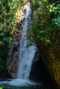 Clear water from a waterfall, running through many stones, through plants, creating many small waterfalls in its path, suggests th Royalty Free Stock Photo