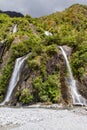 A small waterfall on the way to Franz Josef Glacier. South Island, New Zealand Royalty Free Stock Photo