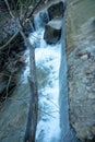 Small waterfall in a wild forest Royalty Free Stock Photo