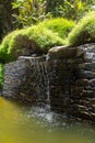 Small waterfall in zen natural park Royalty Free Stock Photo