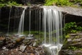 Small waterfall Zornaitoarea forest hill Romania green foliage Royalty Free Stock Photo