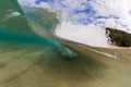Small wave breaking over sandy beach at waimea bay hawaii Royalty Free Stock Photo