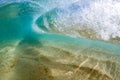 Under water view of Small wave breaking over sandy beach at waimea bay hawaii Royalty Free Stock Photo