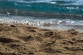 Waves Crashing On A Sandy Beach