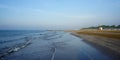 Small waves on Italian coastal sandy beach