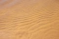 Small waves on the sand under the water of the clear sea. Yellow clean sand in the water, clean bottom of sea. Sandy Royalty Free Stock Photo