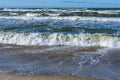 Small waves on the sea, ships on the sea horizon, Baltic sea coast Royalty Free Stock Photo