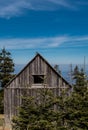 Small Weathered Cabin High on Mountain Top