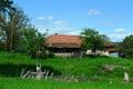 small well in front of a village house