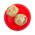 Small wheat bun turkey sandwiches on red plate Royalty Free Stock Photo