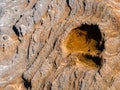 Small whelks and a round rock formation on a beach Royalty Free Stock Photo