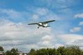 Small white airplane landing Royalty Free Stock Photo