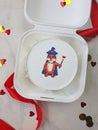 Small white bento cake with a drawnwizard tiger as a gift for the holiday Royalty Free Stock Photo