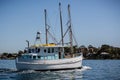 Small white and blue fishing boat underway in Sydney Harbour, Sydney, Royalty Free Stock Photo