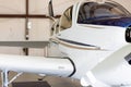 Small private propeller plane in hangar Royalty Free Stock Photo