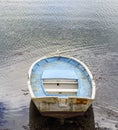 Small white boat with blue interior and a flag of Spain in the E Royalty Free Stock Photo