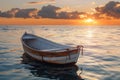 A small white boat is floating in the ocean at sunset Royalty Free Stock Photo