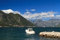 Small white boat moored to the dock. Montenegro Royalty Free Stock Photo