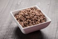 Small white bowl of cooked ground meat