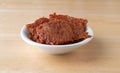 Pork jerky in a white bowl on a table Royalty Free Stock Photo