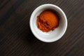 Small white bowl with red pepper powder Royalty Free Stock Photo
