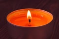 Small white candle burns on dark background Royalty Free Stock Photo