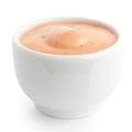 Small white ceramic dish of pink sauce.