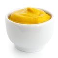 Small white ceramic dish of American mustard. Royalty Free Stock Photo