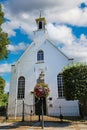 Small white chapel in rural dutch village