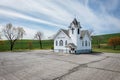 A small white church with a cross on top Royalty Free Stock Photo