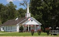 Small White church With Flags in Rural East Texas Royalty Free Stock Photo