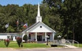 Small White church With Flags in Rural East Texas Royalty Free Stock Photo