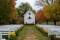 A small white church surrounded by colorful flowers in the foreground, Quaint wedding scene at a country church, AI Generated Royalty Free Stock Photo