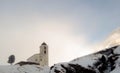 Small white church in winter in the Swiss Alps